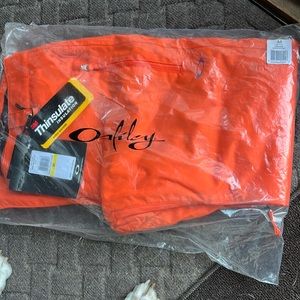 Brand new Oakley orange snowboarding pants